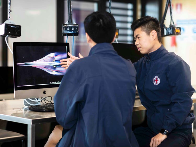 Students working on an iMac in a computer lab