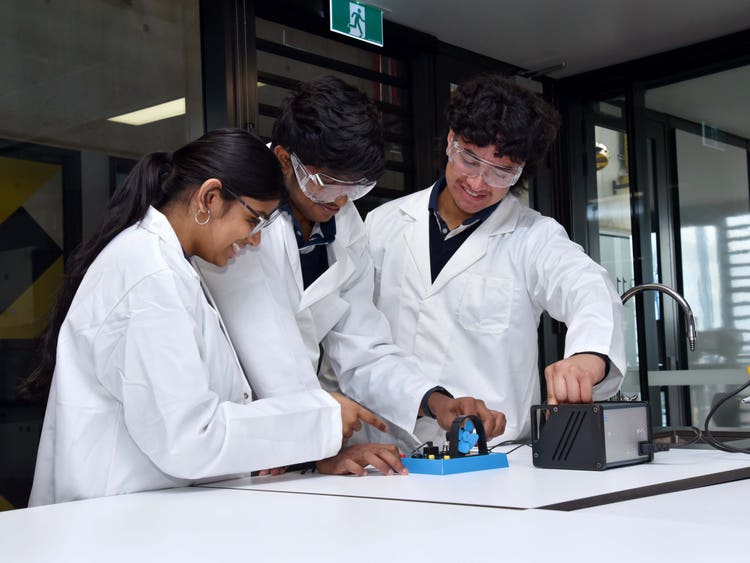 Students working on an electronics science project