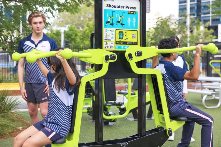 Junior students working out on outdoor gym