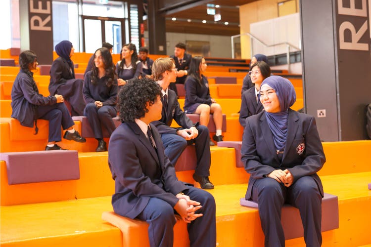 SRC sitting on tiered seating in Auditorium